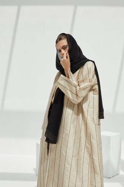 Beige abaya with black stitch lines
